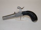 a gun that is sitting on top of a table