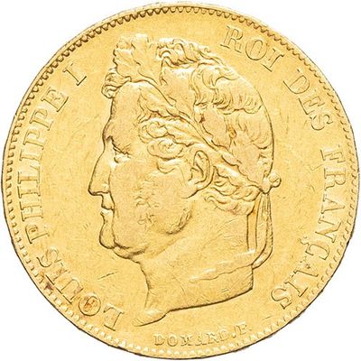 a close up of a gold coin with a woman ' s head on it