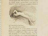 an open book with a drawing of a woman laying on a bed