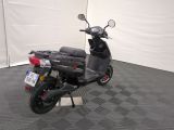 a scooter that is parked in a garage