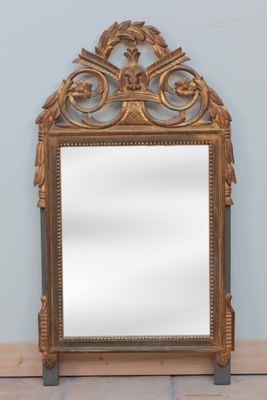an image of a mirror sitting on top of a wooden floor