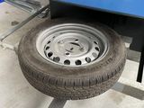 a tire that is sitting on the side of a truck