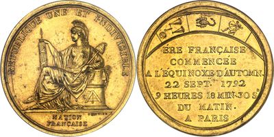 une pièce d'or à l'effigie d'une femme assise sur un trône