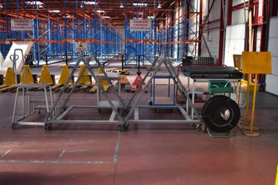 a picture of a large warehouse with a lot of shelves