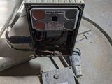 a small air conditioner sitting on the floor next to a heater