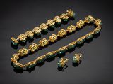 a gold and green necklace, bracelet, and earring set