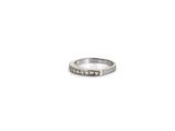 a close up of a ring on a white surface with a white background