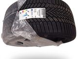 a close up of a tire on a plastic wrap
