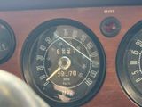 a close up of a car dashboard with gauges and speedometers
