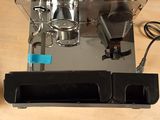 an image of a coffee machine on a wooden table