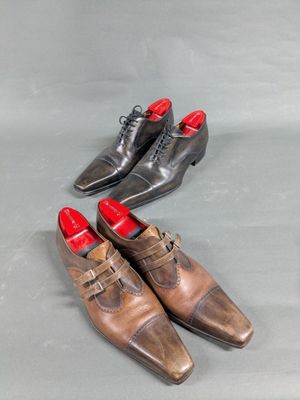 three pairs of men ' s shoes are lined up on a gray surface