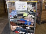 a cart with a bunch of clothes on it in a warehouse