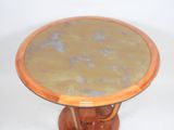 a small table with a marble top on a pedestal