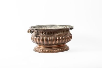 a metal bowl with a handle on a white background