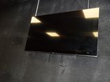 a flat screen tv hanging on the wall in the room