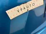 a sticker that says vauto on the side of a blue car