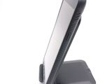 a cell phone that is sitting on top of a stand