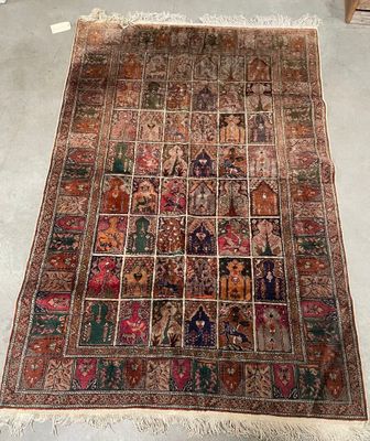 an old rug with a lot of different designs on it