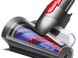 a red and black vacuum that is on top of a table