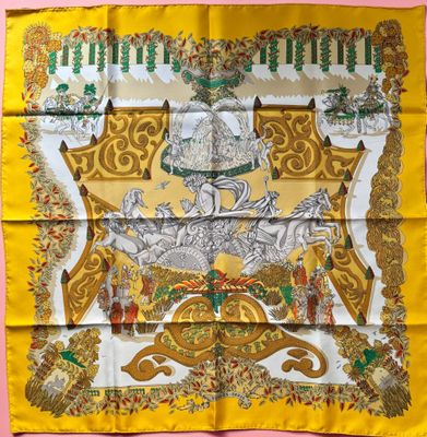 a yellow silk scarf with a picture of a man on a horse