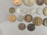 a lot of coins that are on the table