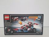 the box is open to show the contents of the lego speed car