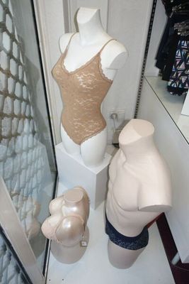 a mannequin in the corner of a room with a mannequin in front of it