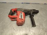 the drill is sitting on the table next to the tool