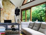 a picture of a living room with couches and a fire place