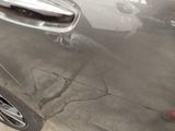 a close up of a car door handle on the side of the car