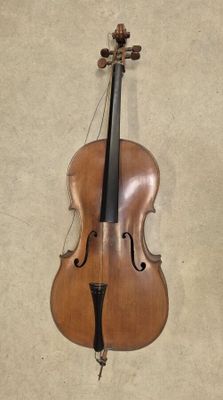 a violin hanging on the wall next to a wall