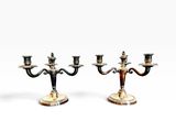 pair of silver plated candlesticks on marble bases