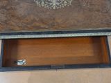 a wooden box with a decorative design on it