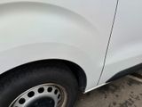 a white van parked on the side of the street