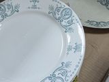 two plates that are sitting in a cardboard box