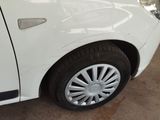a white car that is parked in a garage