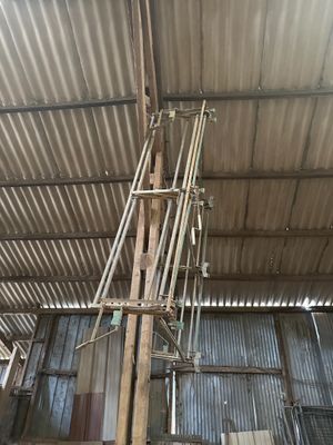 a large metal structure with pipes and wires in a building