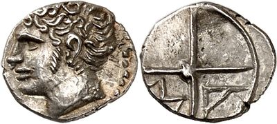 a silver coin with an image of a man on it
