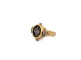 a close up of a gold ring with a black stone in the center