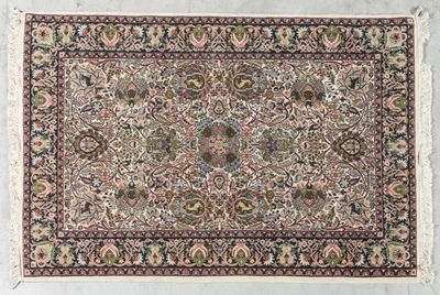 an antique persian rug with a floral design on a white background