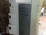 a refrigerator that is sitting in the corner of a room