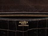 hermes, a dark brown crocodile skin leather handbag