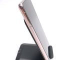 a cell phone that is sitting on top of a stand