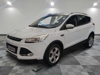 the white ford kuga suv is parked in the garage