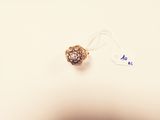 a small bead that is sitting on a white surface