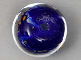 a close up of a blue bowling ball in a bowl