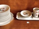 a lot of plates and cups on the table