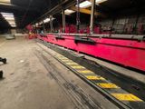 an image of a large red machine in a factory