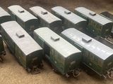 a lot of train cars that are sitting on the floor