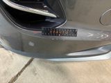 a close up of a car ' s bumper with a sticker on it